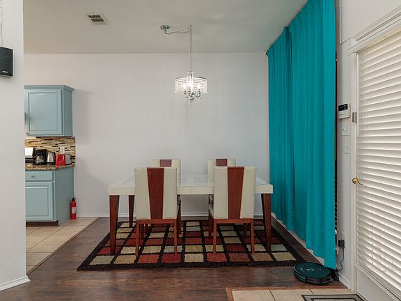 Dining area off kitchen with table and seating for 4.