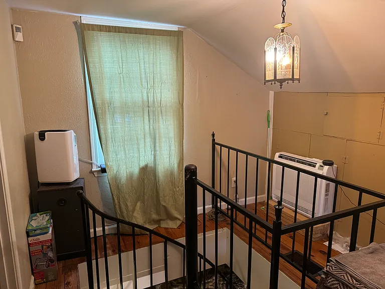 2nd of 3 mini-split units and dehumidifier located on landing of staircase (part of bathroom doorframe can be seen in bottom left of pic)