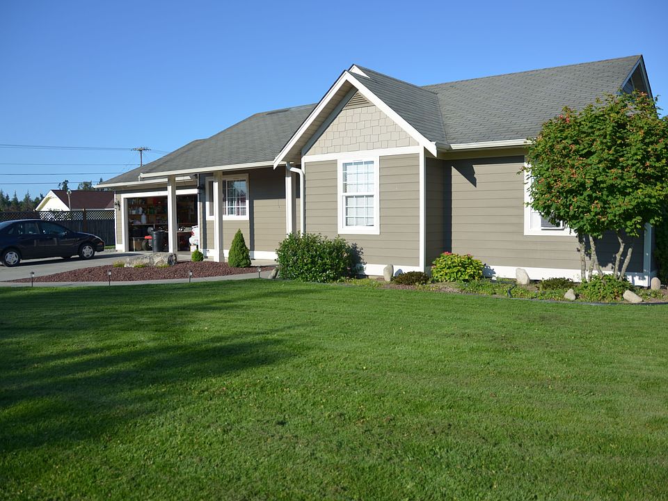 Front of house with rich green grass