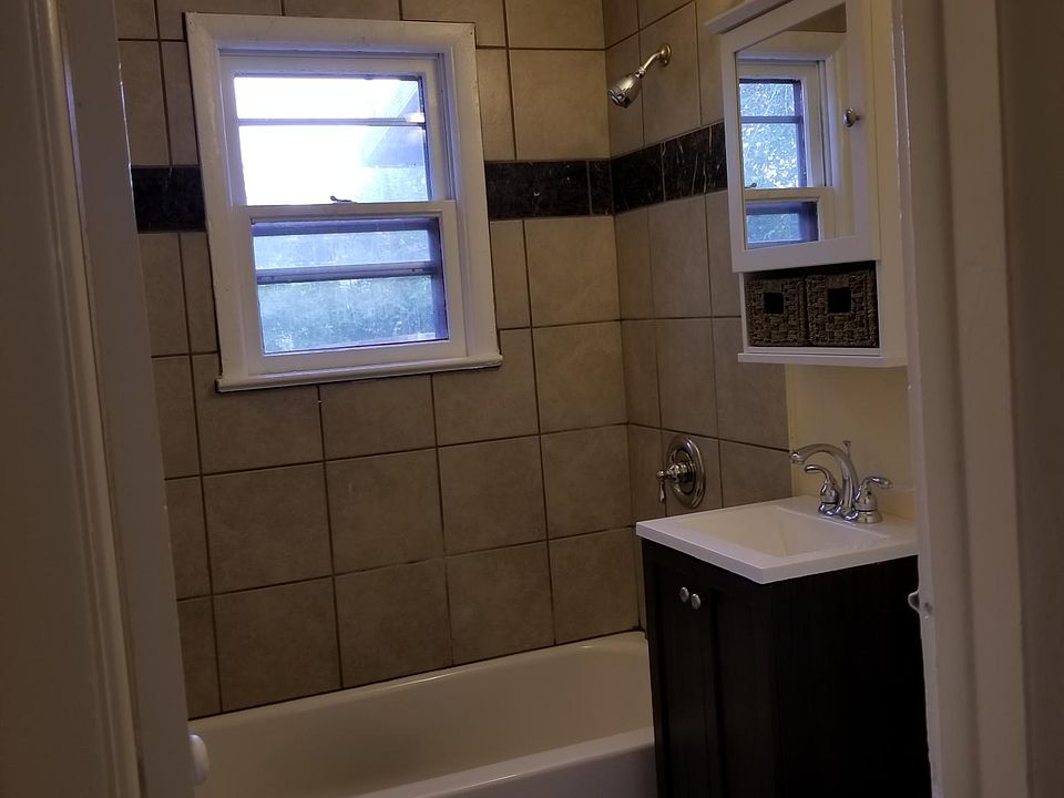 cool bath with new vanities, new flooring and designer accents