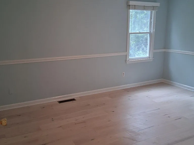 Bedroom 1 freshly painted with beautiful maple floor