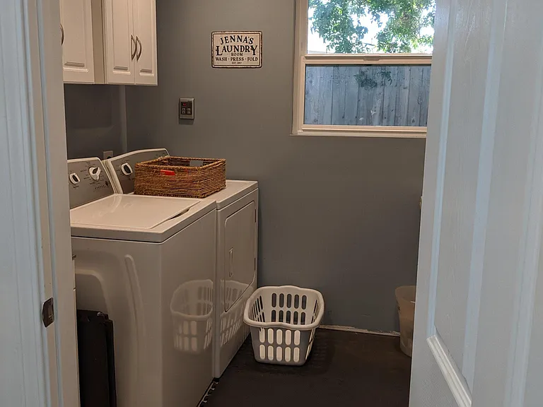 Laundry room, access through the single car garage. Washer/Dryer hookups only, machines not included with house.