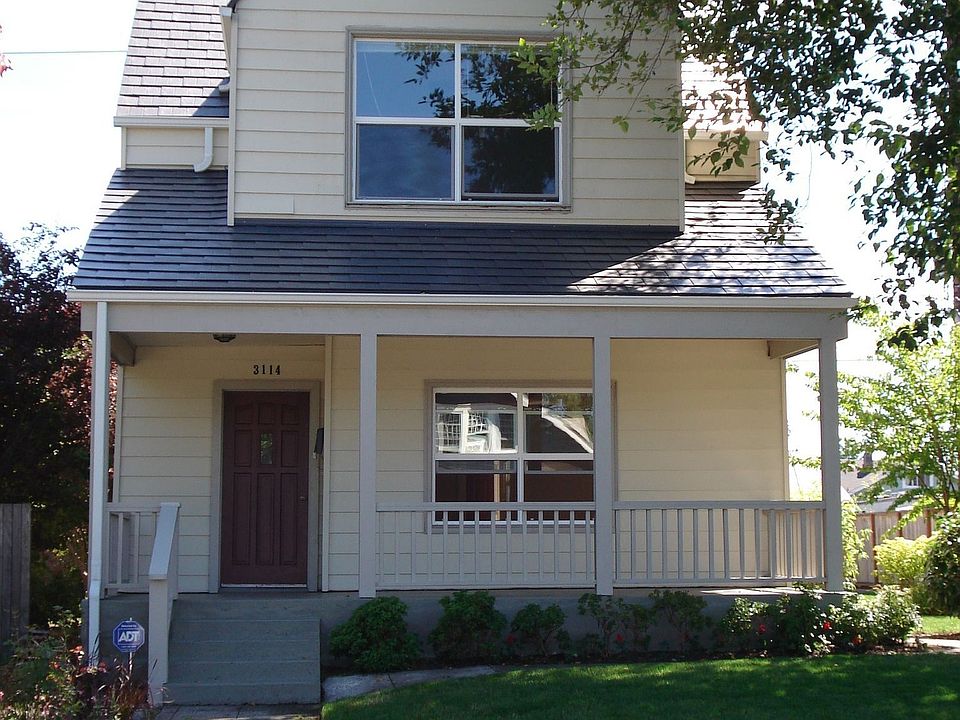 Folk Victorian with classic features inc. an open front porch and gabled roof