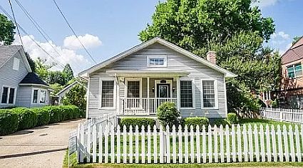 Front porch with pvc fence and parking for 3 vehicles