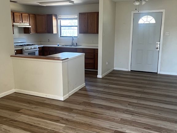 Front door view to living room and kitchen