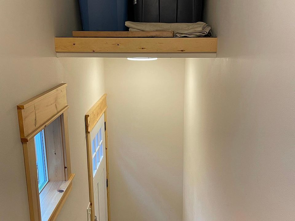 Additional storage at the bottom of the stairs