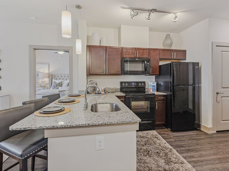 Large kitchen with granite countertops and Espresso cabinets