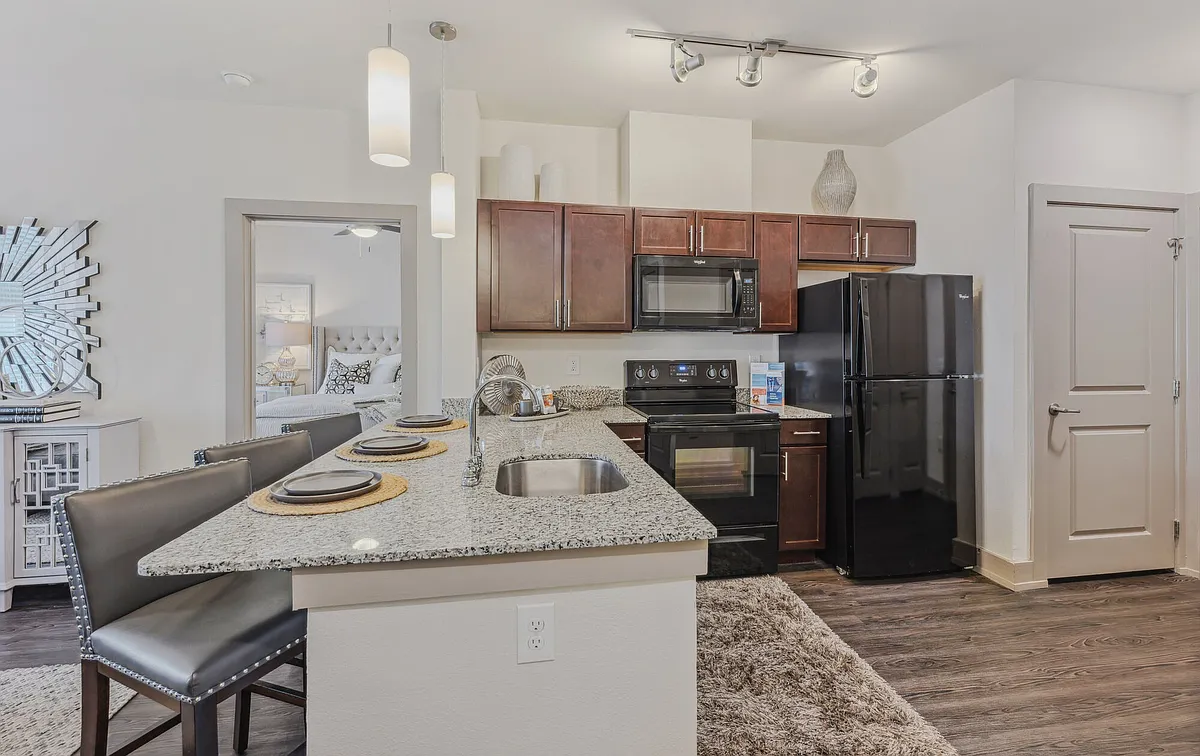 Large kitchen with granite countertops and Espresso cabinets - Steelyard