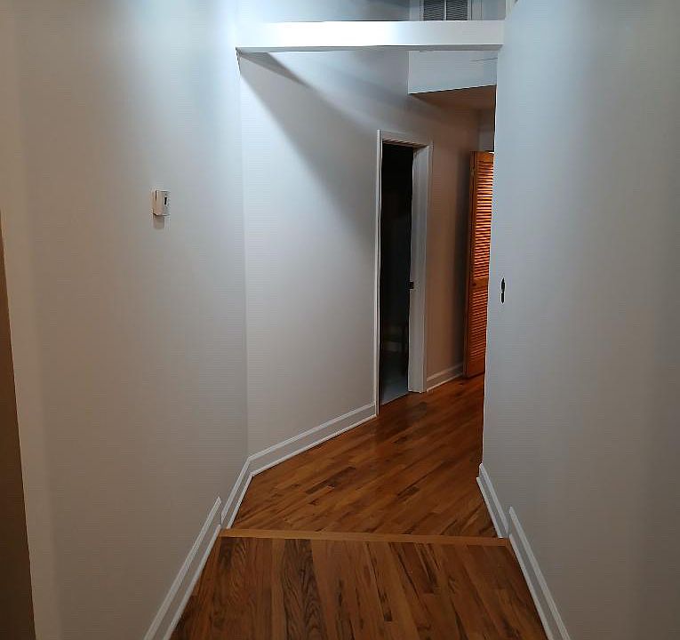 Hall leading to laundry, second bedroom and second bathroom