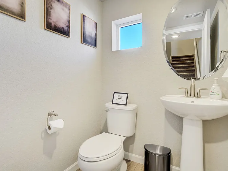 Half Bathroom located off Kitchen