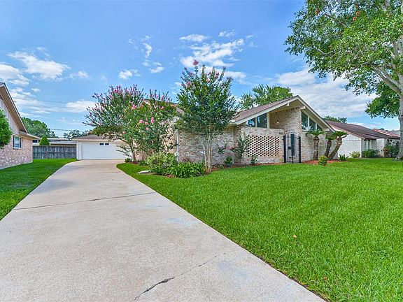 Plenty of parking space on the street and on the long driveway that leads to the 2 car garage.