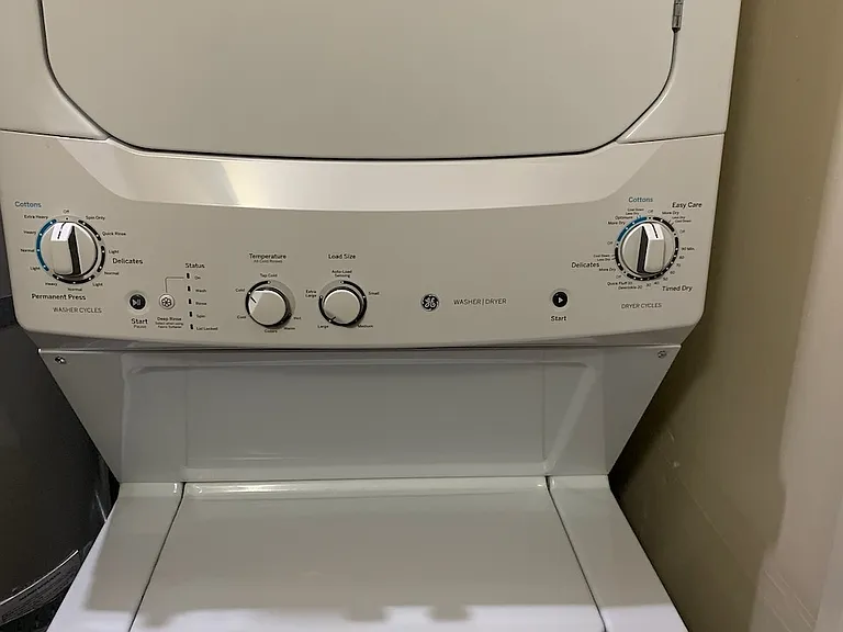 Provided stacking washer/dryer