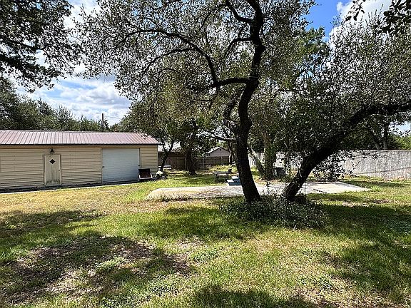 Metal shed and rv pad.