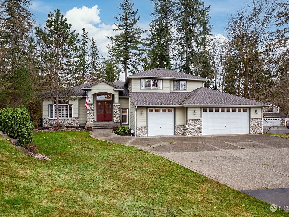 The home is nicely set back from the cul-de-sac street, and has a stone and cement plank siding.  The roof is 50 year architectural composition, and there's a large aggregate driveway leading to the 3 car garage.>