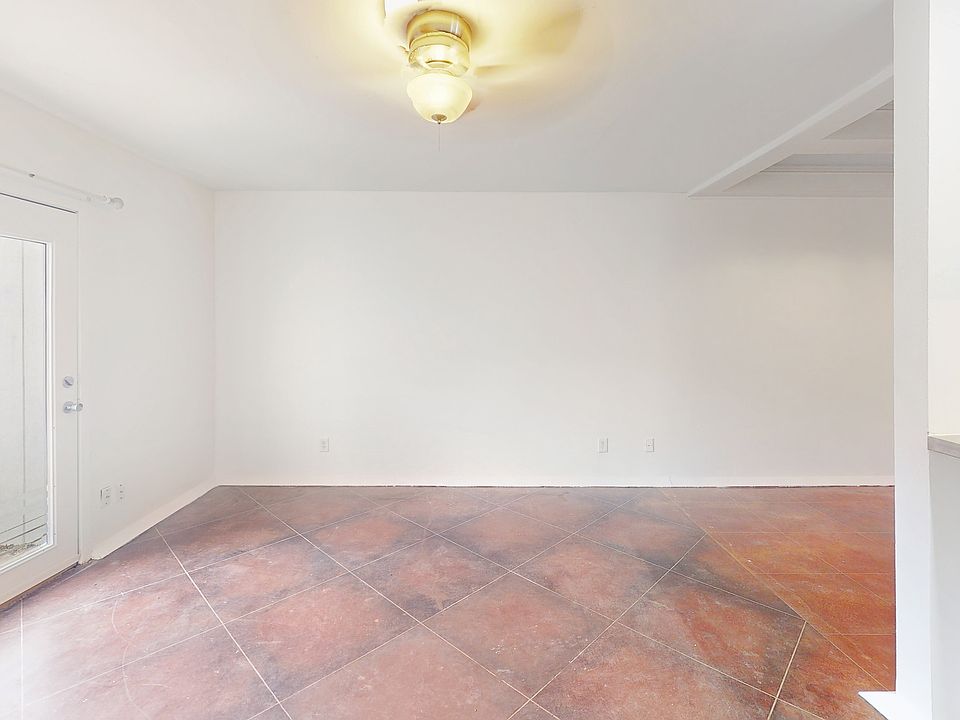 Living & French doors to private patio, bar area. Floors have been polished since this photo