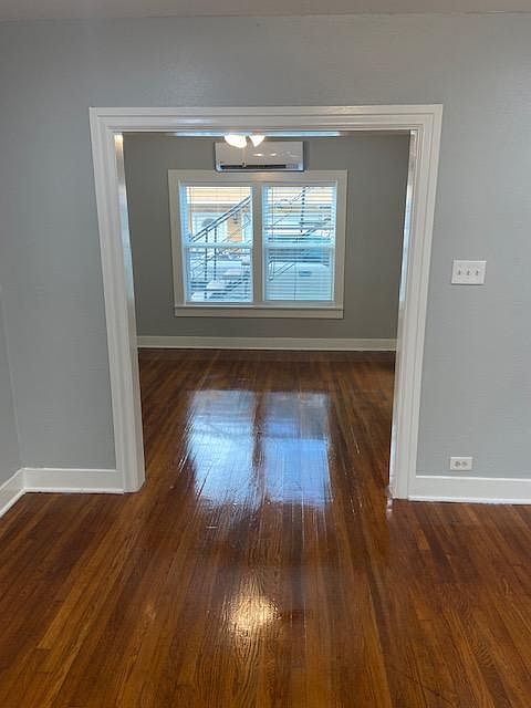 Looking from the spacious living room Front door entry, through and to the dining room.