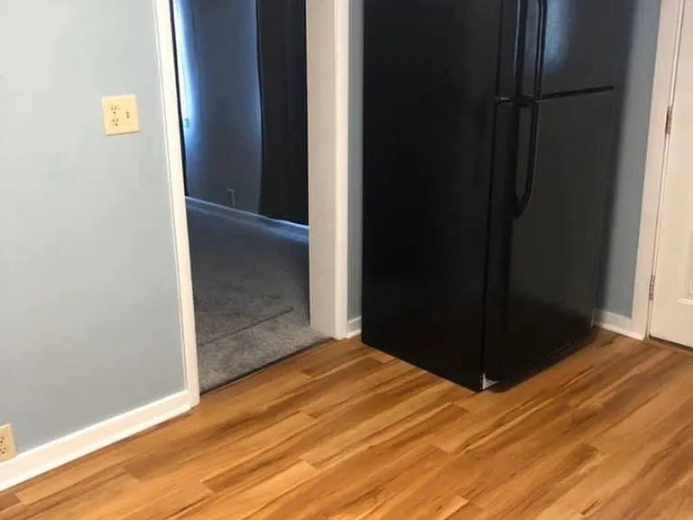 extra photo of kitchen area. door way goes to extra living space & living room