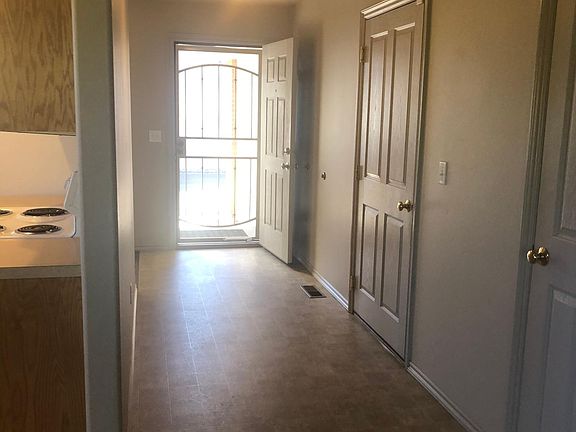 Entry, door to garage and coat closet