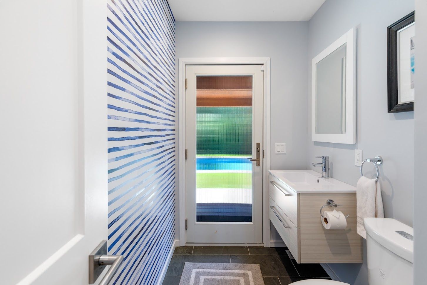 1st level powder room leading to the...