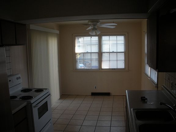 Sunny eating area with door to deck