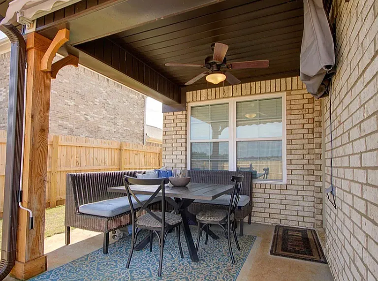 Back patio with ceiling fan