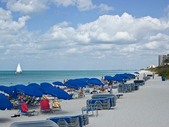 Pelican Bay Beach with all amenities including umbrellas,beach chairs/chaises, cabanas, showers and bathrooms