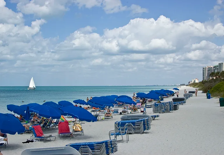 Pelican Bay Beach with all amenities including umbrellas,beach chairs/chaises, cabanas, showers and bathrooms