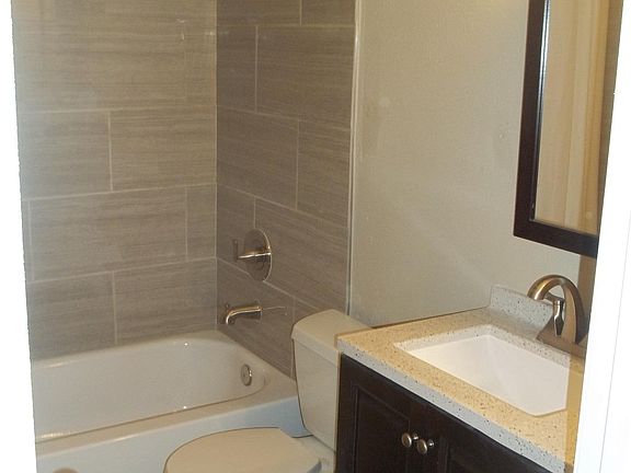 BATHROOM with ALL NEW FIXTURES, PAINT, SHOWER TILE, WOOD FLOOR VANITY AND MEDICINE CABINET