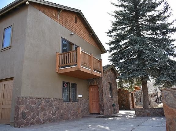 Single car garage with interior entry into vestibule. Single car off street parking pad in front of home. The balcony has a magnificent view of the Peaks.