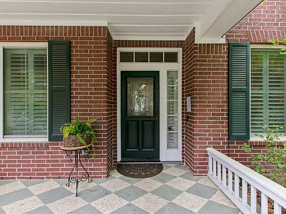 Charming harlequin design on front porch floors.