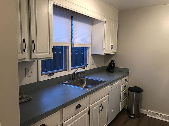 Efficient galley kitchen opens to dining room