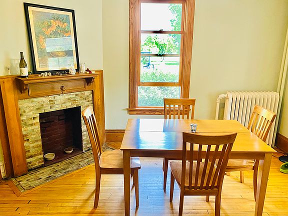 front dining or living room with ornamental fireplace