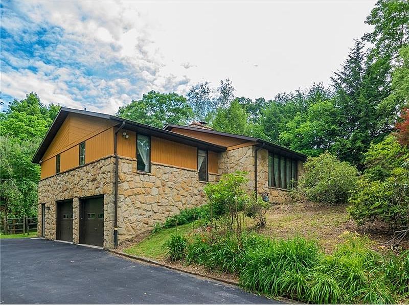 Stone and Cedar exterior. Roof was replaced 6 years ago. Plenty of space in the driveway.