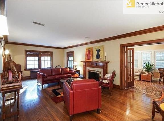 Formal Living Room with Fireplace and Sunroom