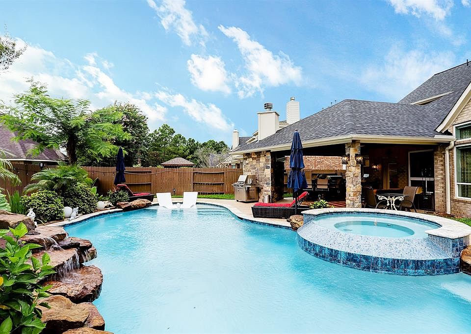 Welcome to the astonishing backyard oasis of your dream home! It's perfect for the hot summers in Texas.
