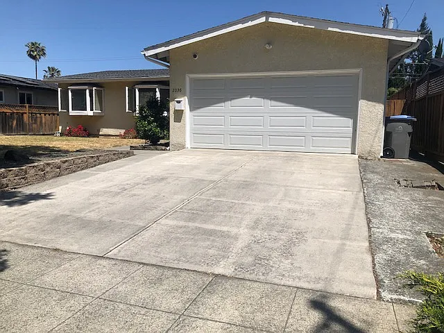 Attached 2 car garage. Garage floor was power washed and super clean with lots of indoor built in storage shelves