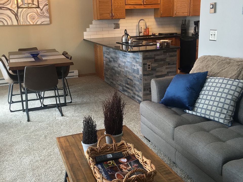 View through front room to dining area and kitchen