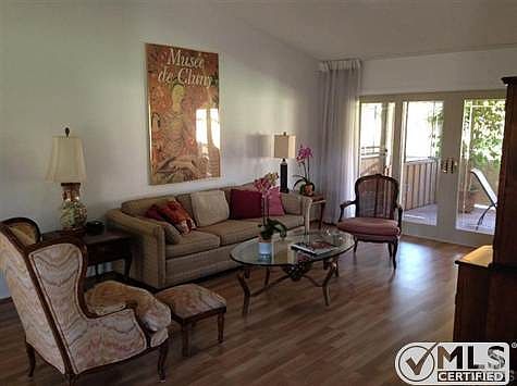 Living Room w/ tall canted ceiling