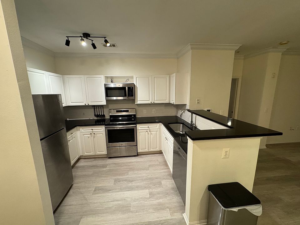Kitchen after turning left from the front door - door on the right is primary bedroom