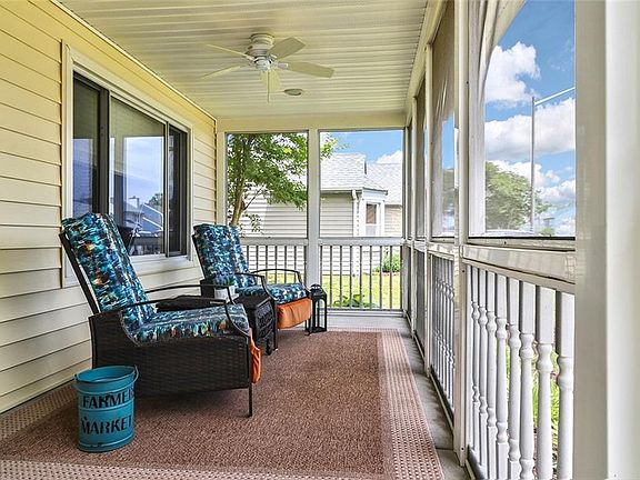 Screened Front Porch is the perfect spot to enjoy the quiet neighborhood.