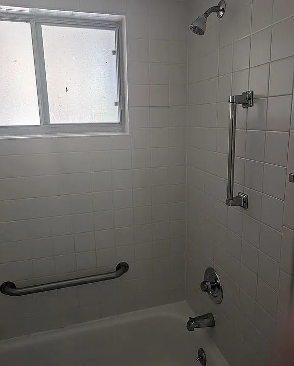 Shower/tub with grab bars 