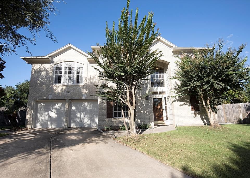 This home is on the end of the cul de sac. Custom made shutters stained to match the front door.