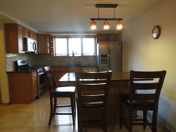 new kitchen with stainless steel appliances