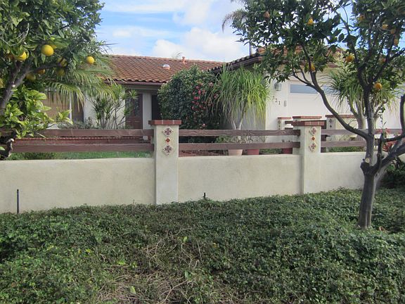 Stucco wall with split rails