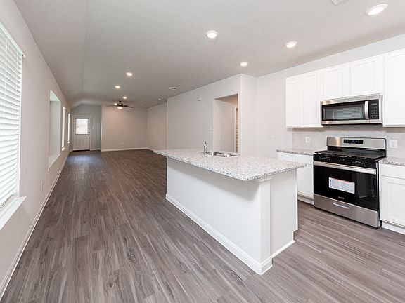 Kitchen to Dining Area and Family Room