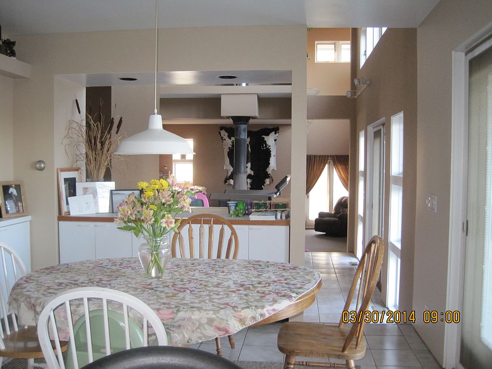 view from kitchen through dining room and into sunken living room