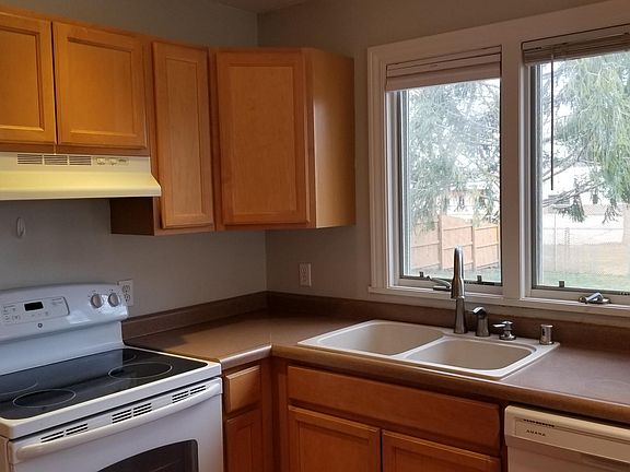 Kitchen with dishwasher, stove and disposal
