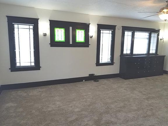Actual unit will feature another built-in with desk under the stained glass windows.