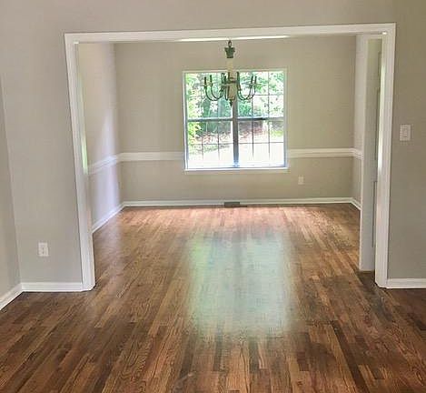 Formal dining room & living room, with new hardwood floors throughout the entire home.