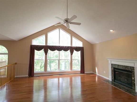 Hardwood floors shown off to their best advantage with all the natural light coming in and the huge windows offer lovely views a